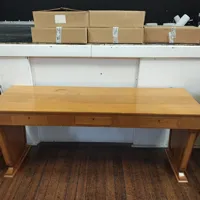 Large wooden desk with three drawers