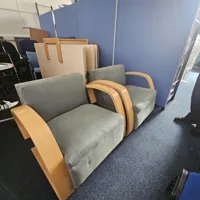 2 Wooden framed soft chairs and small coffee table