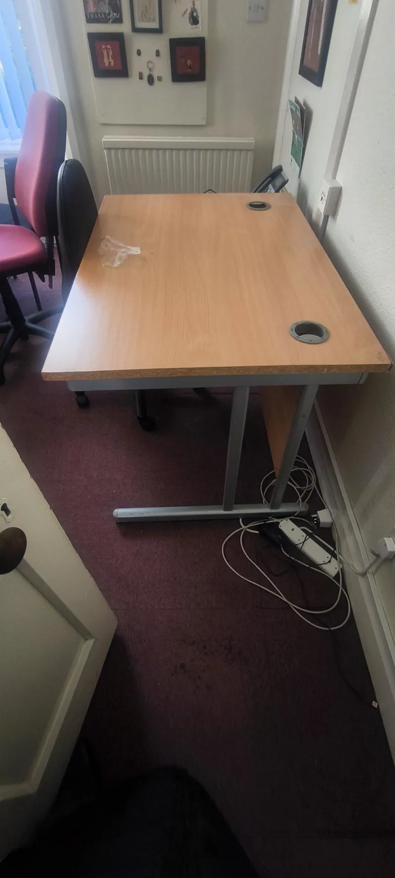Wooden office desk with metal frame and cable ports