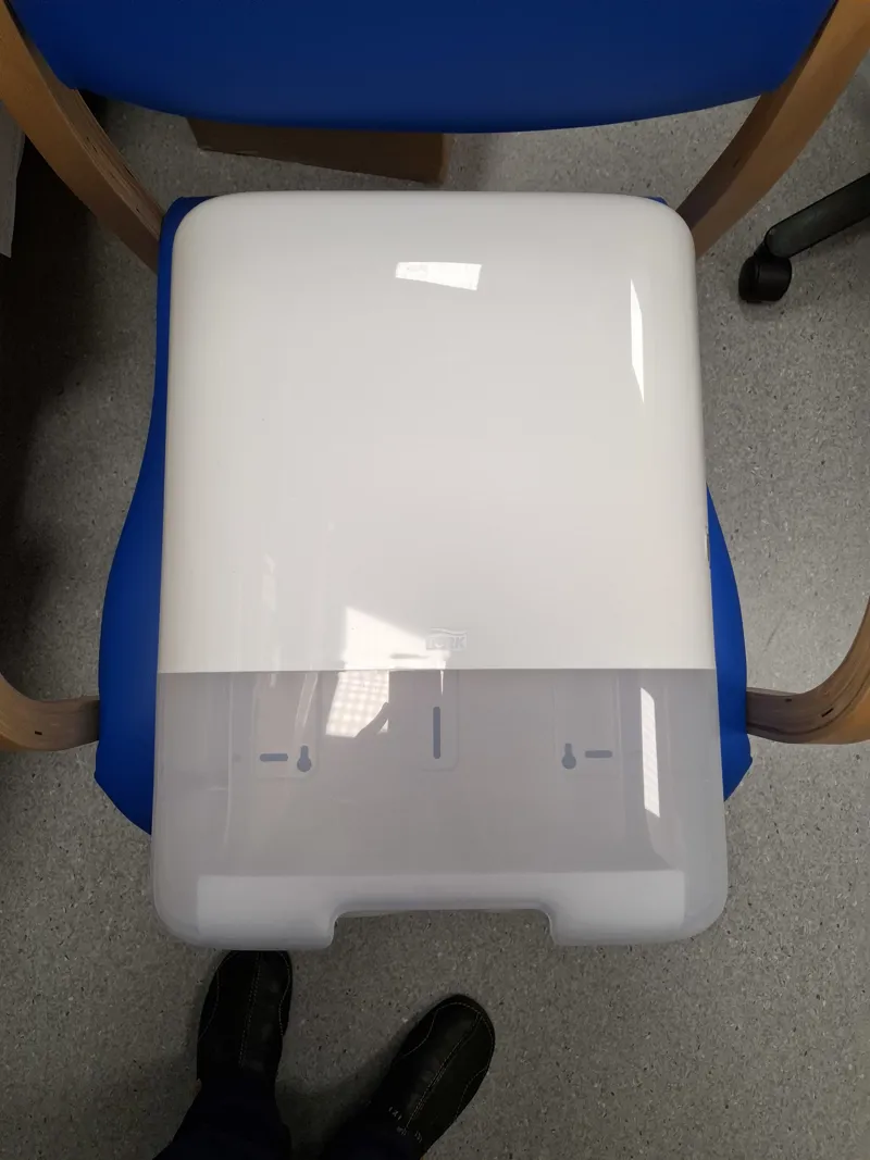 Paper towel dispenser with white casing