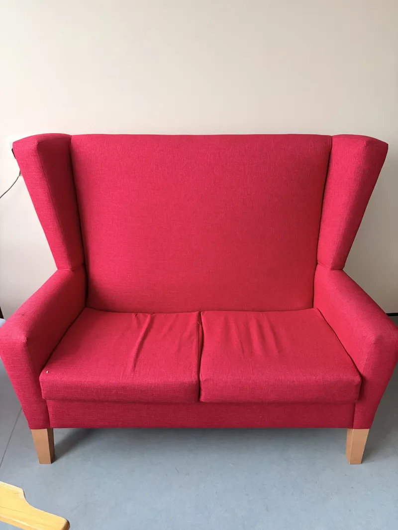 Pink/Red Upholstered Wingback Armchair with Wooden Legs