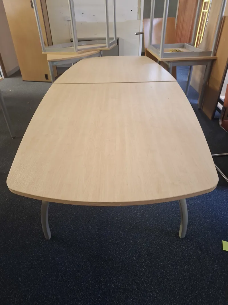 Light oak extending dining/meeting table with curved ends