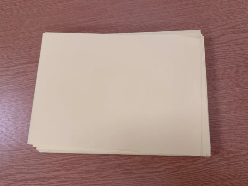 stack of pale yellow paper