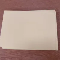 stack of pale yellow paper